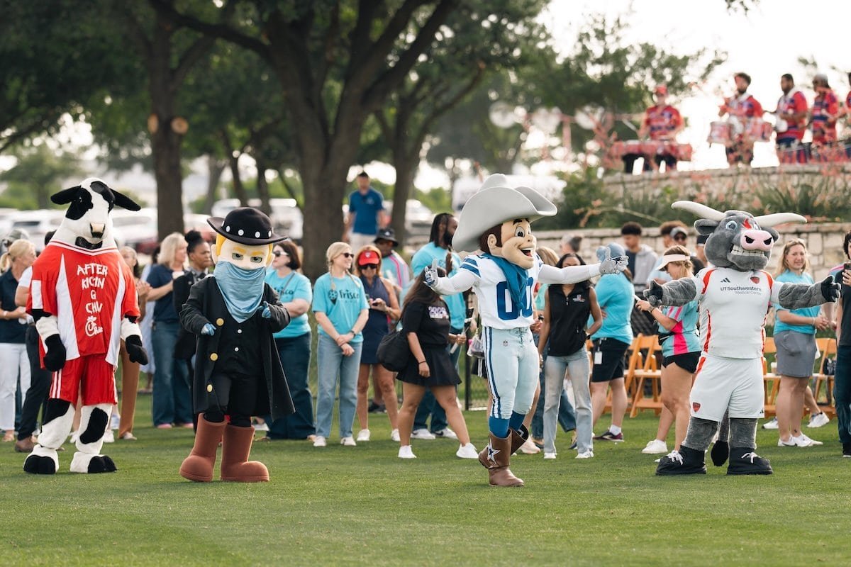 Texas team mascots entertain a crowd.
