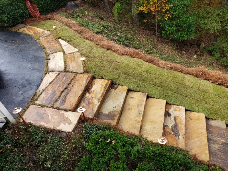 Natural stone landscape stairs and pathway design by John Russell Landscape Architect, emphasizing custom hardscape solutions and garden enhancement.