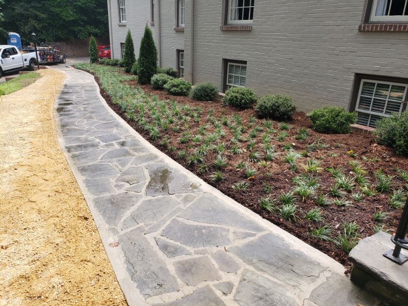 Natural stone landscape pathway for residential garden design by John Russell Landscape Architect, enhancing curb appeal and outdoor living.