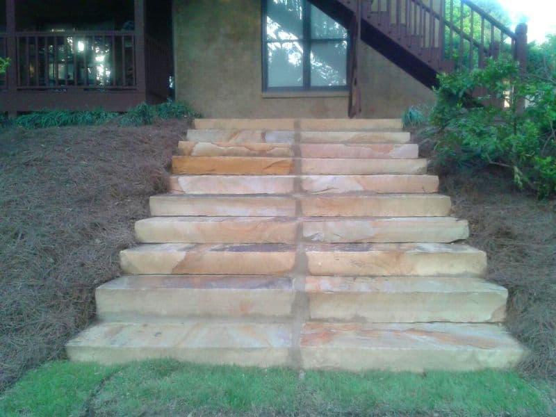 Natural stone outdoor staircase design by John Russell Landscape Architect, enhancing garden aesthetics and functionality.