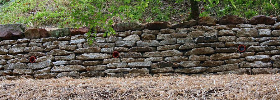 Retaining wall built with natural stone for landscape architecture by John Russell Landscape Architect.