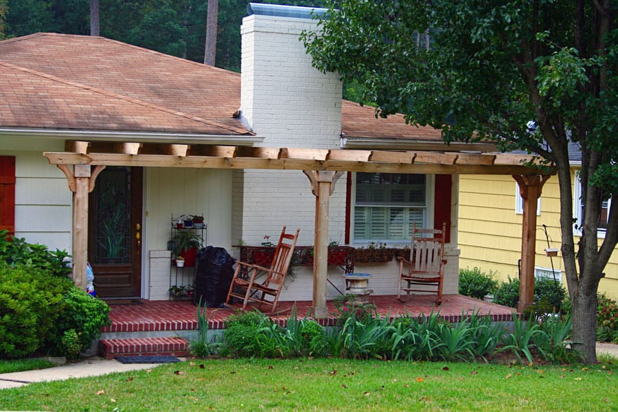 Wooden porch cover installation - John Russell Landscape Architect.