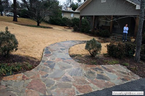 Natural flagstone walkway design by John Russell Landscape Architect for elegant outdoor pathways.