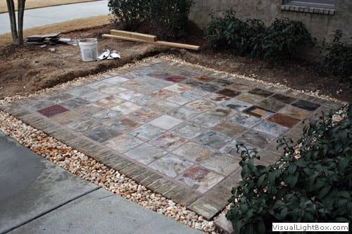 Colorful stone patio design by John Russell Landscape Architect, outdoor living space planning, natural stone paving, landscape design, garden renovation.