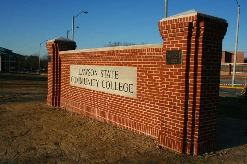 Lawson State Community College brick entrance sign with landscape surroundings and modern urban environment.