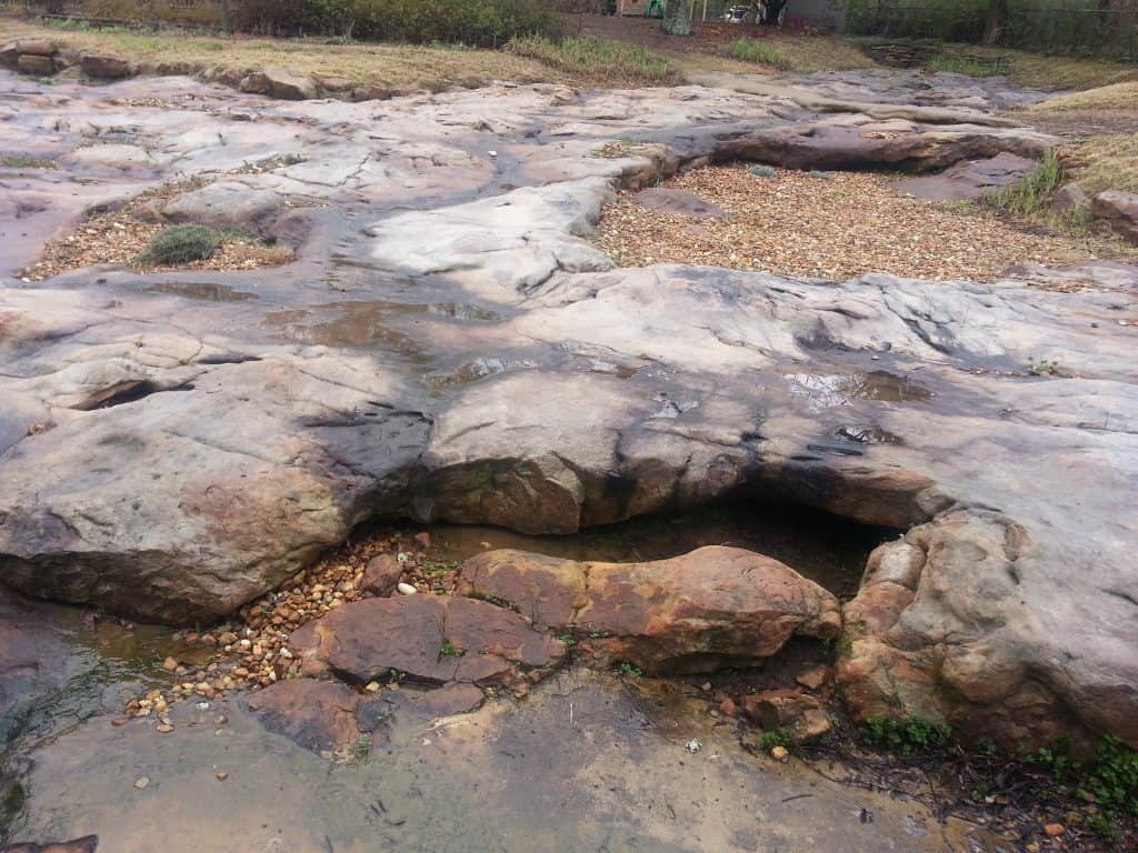 Natural stone landscape design by John Russell Landscape Architect, showcasing innovative outdoor hardscape and landscape solutions.