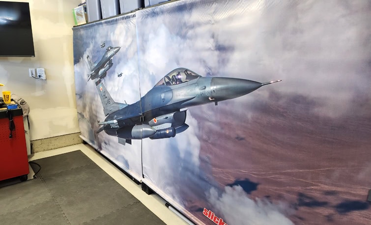 Pair of 6x9 vinyl banners used as workshop dust covers and backdrop