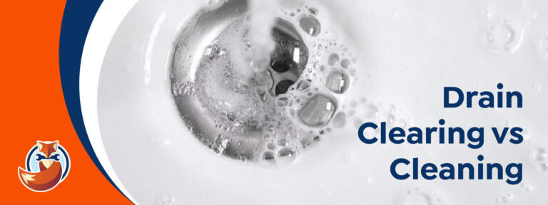 Water flows into a white sink drain with bubbles; text reads "Drain Clearing vs Cleaning" and a fox logo appears in the lower left corner.