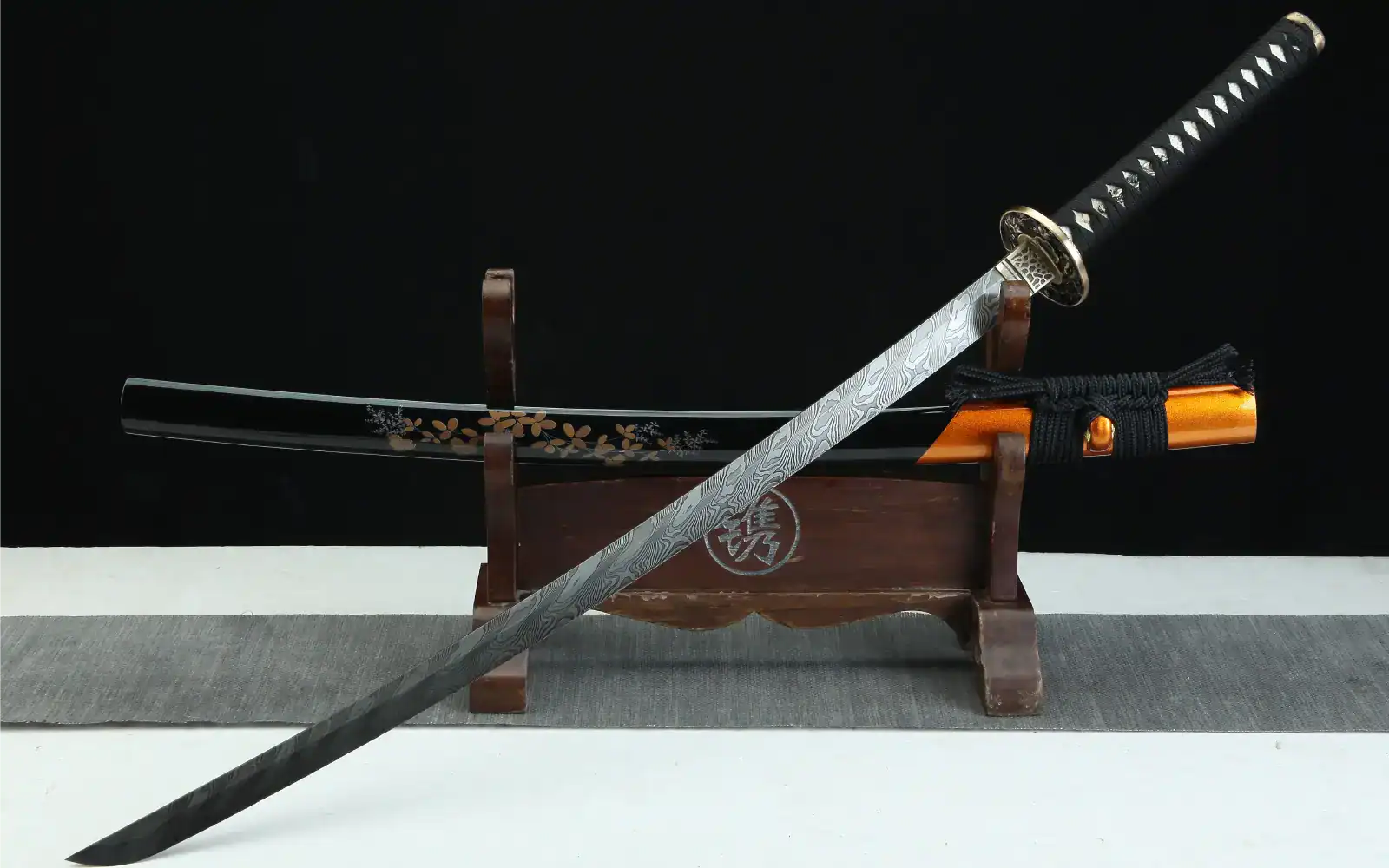 Damascus katana showing flowing wood-grain layer pattern