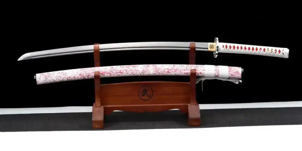 a katana sword displayed on wood stand
