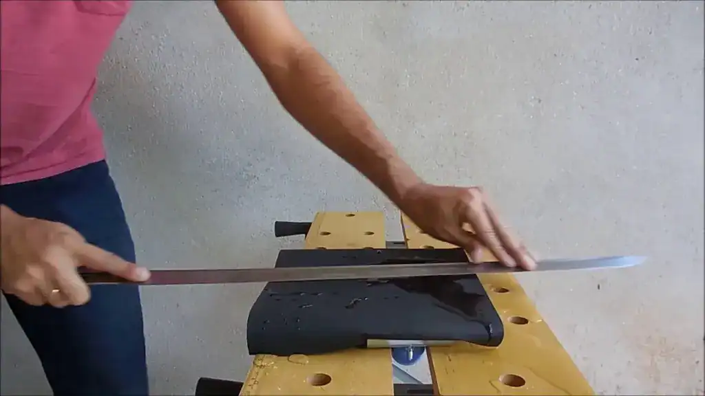 katana sharpening stroke on whetstone