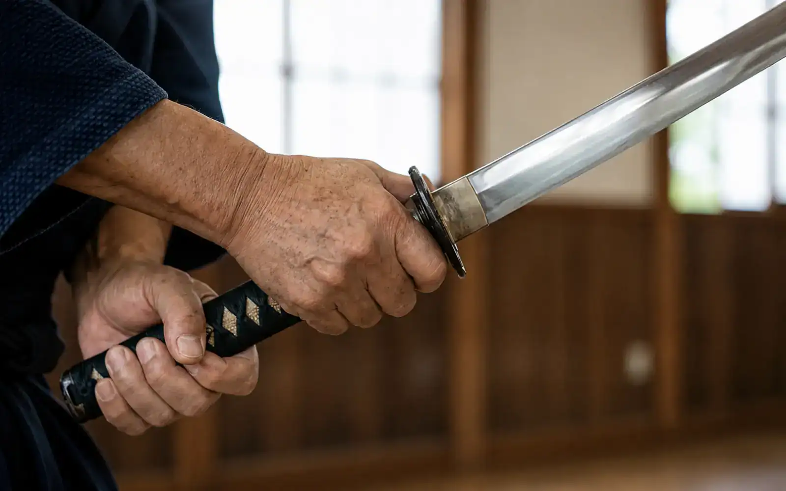 Katana blade held for inspection