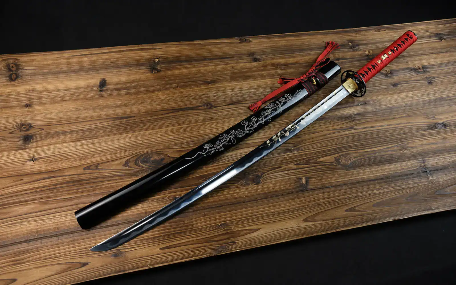 a katana displayed on wooden tabletop