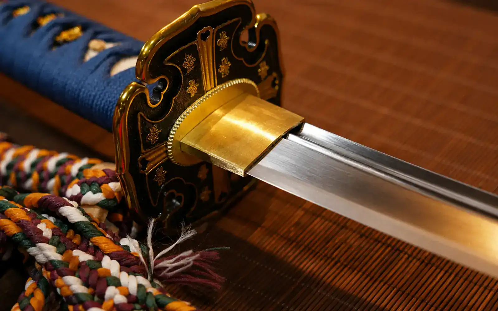 gold tsuba on katana blade