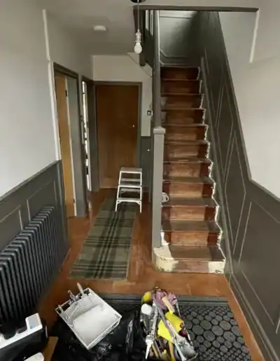 Interior staircase painting and decorating service in progress.