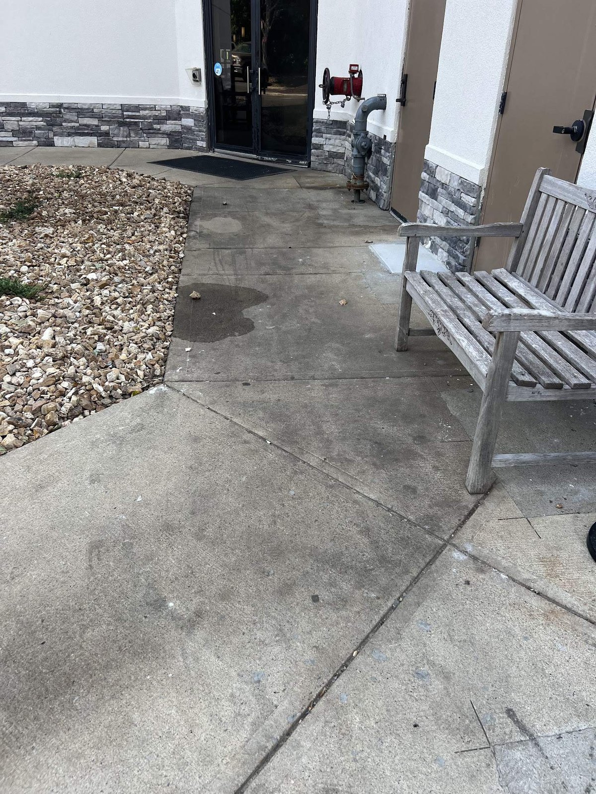 Commercial concrete before cleaning — Hampton Inn entry, Kansas City