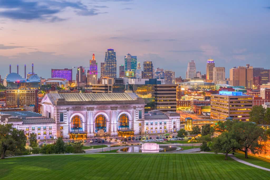 Modern Kansas City skyline at dusk with illuminated Union Station and downtown buildings, representing trusted legal services by The Law Office of Benjamin Arnold for Kansas City residents.