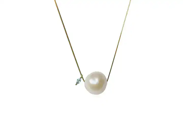 A Delicate 18K Gold-Filled Necklace Featuring A Baroque Freshwater Pearl And A Sparkling Moissanite Gemstone.