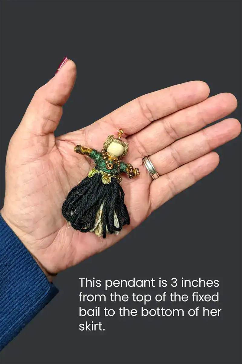 Shows Celtic Couple Pendant Set lady in the palm of a woman's hand.