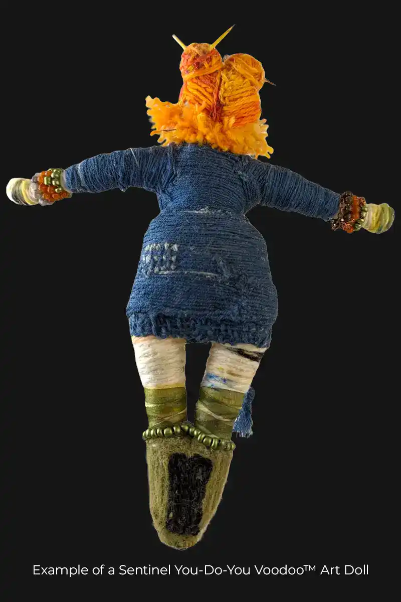Back view of Butterfly art doll, showcasing orange hair, blue dress, bead details, and layered texture.