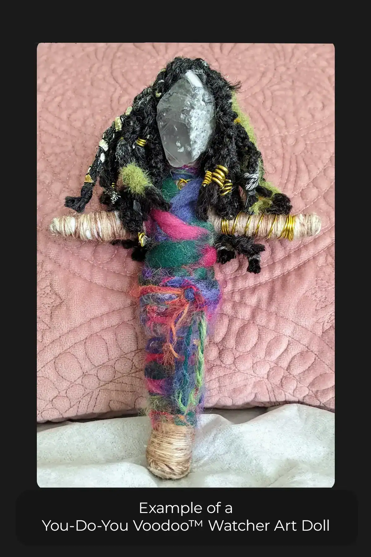You-Do-You Voodoo™ Watcher art doll in a multicolored sarong with black hair standing in front of a pink textured background