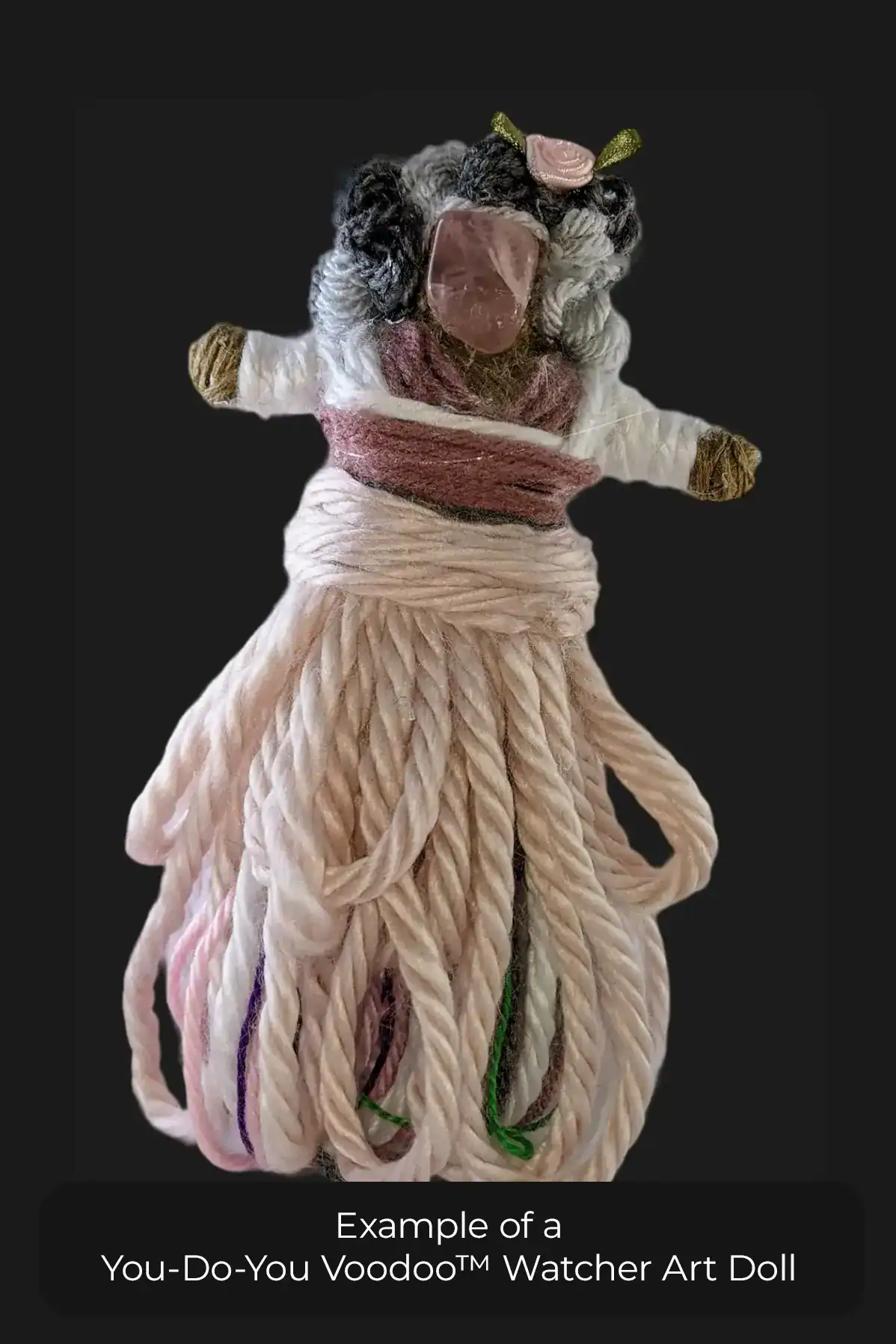 The front view of a You-Do-You Voodoo™ Watcher art doll that reminds me of my grandma. She has curly gray and silver hair, a pink multi-layered dress, and colorful underskirt.