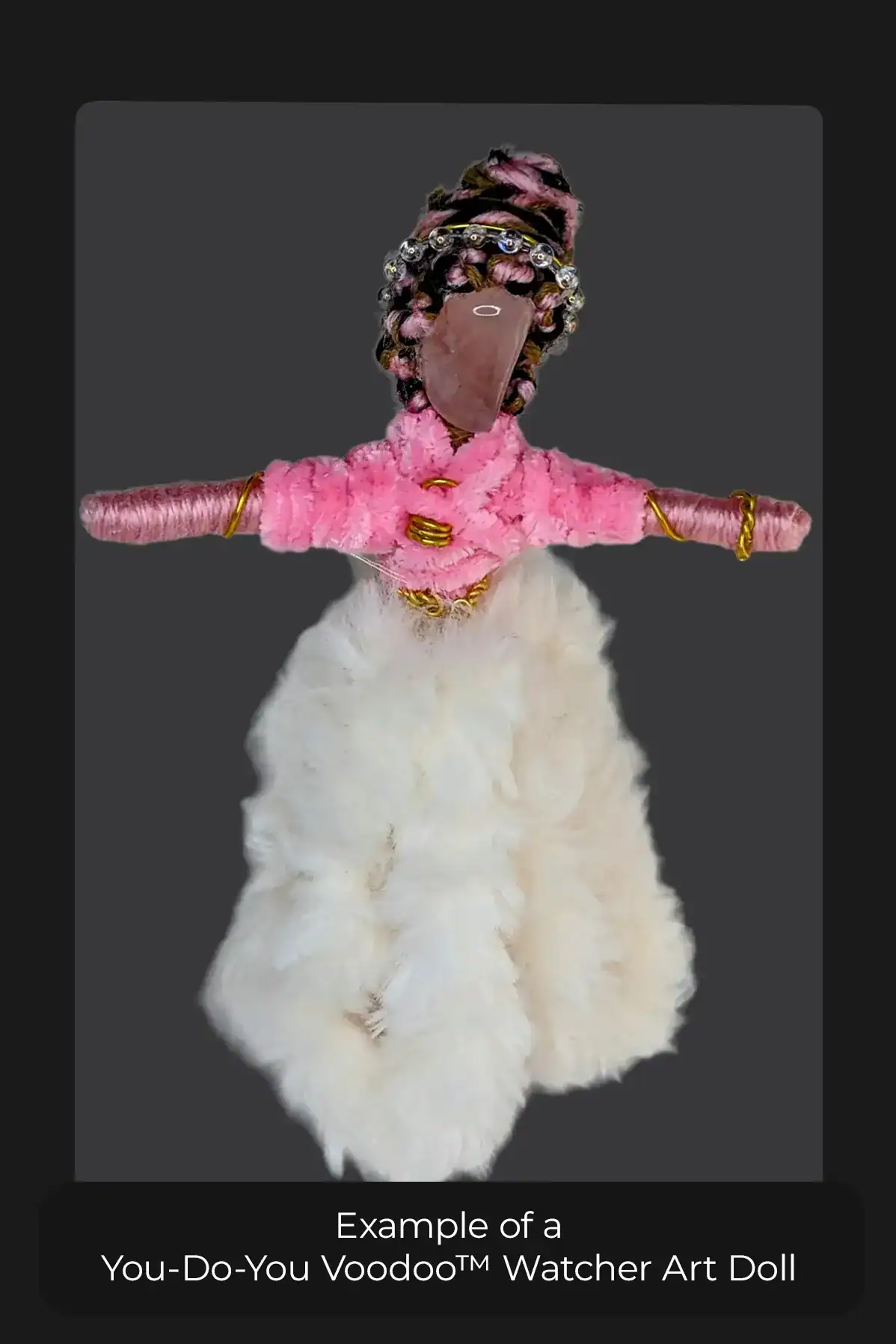 The front view of a You-Do-You Voodoo™ Watcher art doll dressed in a pink top, long, furry skirt, petticoats and jewelry. Her black, pink and brown hair is intricately braided.