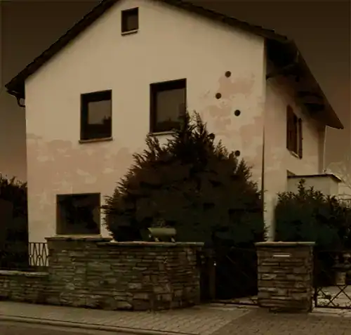 A standard home in Germany, but haunted in a way shadow work couldn't help. White, three story plus a basement. They build up there, not wide.