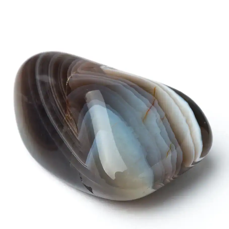 a tumbled agate with rich brown, cream, gray and black bands.