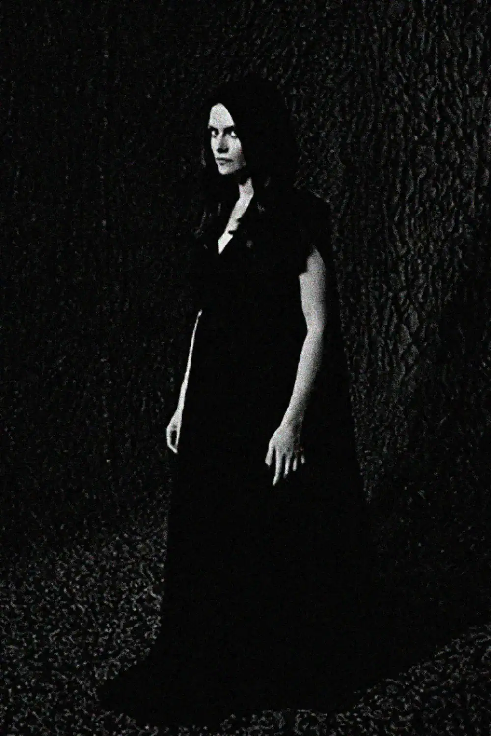 Elegant black and white portrait of a woman representing your Shadow in a long dress.
