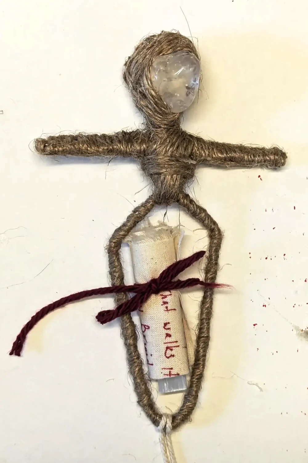 Brigit in the making. Here you see her base form with Brigit's blessing wrapped around selenite and tied with a red bow.