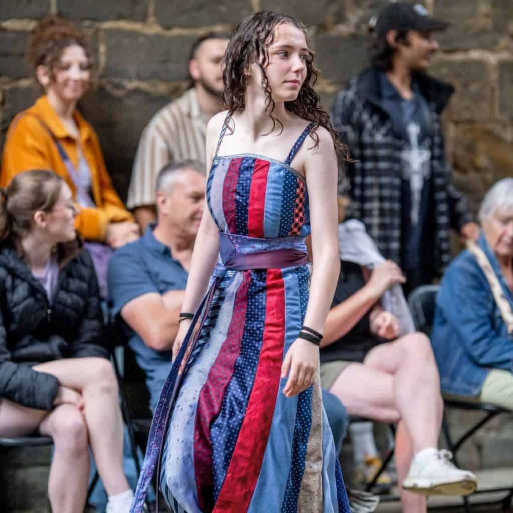 A model wearing a dress made from ties.
