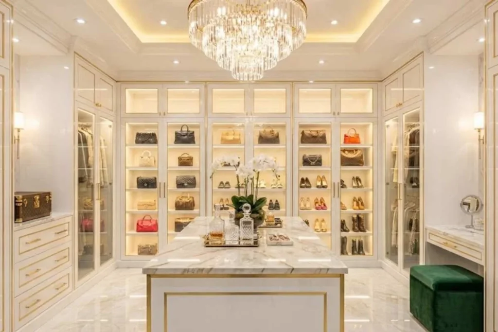 Spacious walk-in closet featuring custom storage and modern lighting