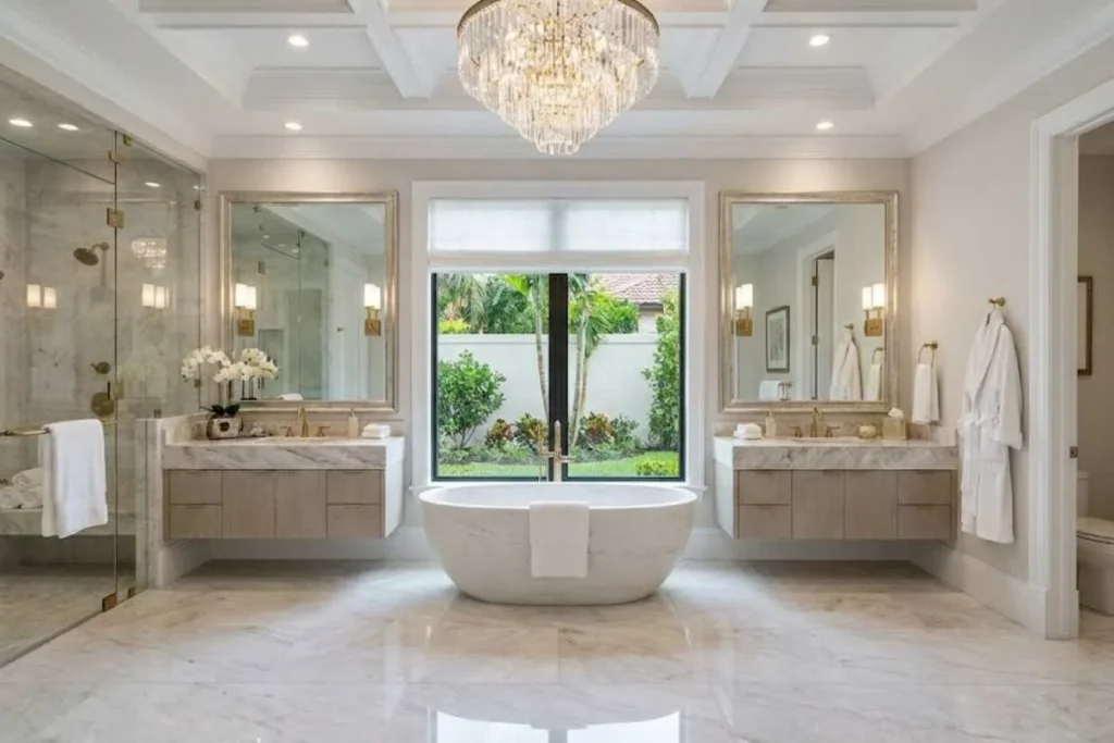 Luxury bathroom design with marble walls, freestanding bathtub, and modern lighting