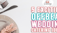 Elegant wedding catering setup with floral decorations and stylish tableware.