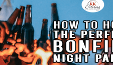 How To Host The Perfect Bonfire Night Party A variety of beer bottles clinking during a bonfire night celebration.