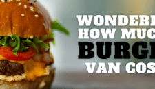 Wondering How Much A Burger Van Cost? Fresh beef burger with lettuce, tomato, cheese, and bun for catering services in the UK.