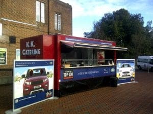 High-quality catering food truck serving British cuisine at outdoor event in the UK.