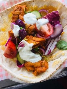 Fresh Chicken Tikka Wrap with vegetables and yoghurt sauce from KK Catering in UK.