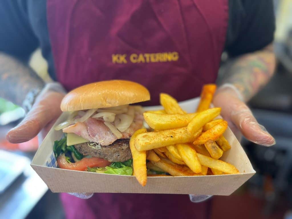 Fresh burger with fries served by KK Catering in a eco-friendly tray, perfect for events and parties.