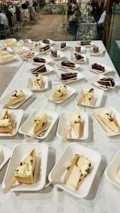 Assorted slices of delicious cake served at an event, showcasing professional catering for special occasions.