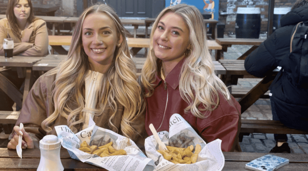 2 women with their fish and chips