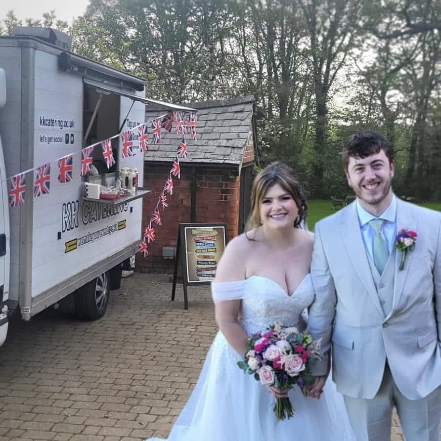 Freshly prepared wedding catering with happy bride and groom in outdoor setting, served by KK Catering.