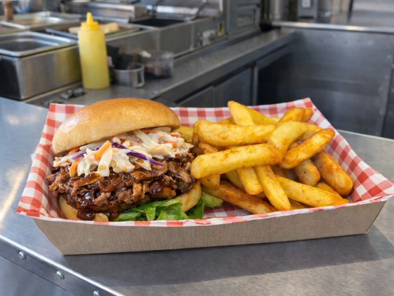 Pulled pork burger with BBQ sauce and slaw from KK Catering street food van hire.