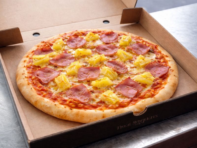 The Controversial pizza with hand-chopped ham and pineapple from KK Catering pizza van hire.