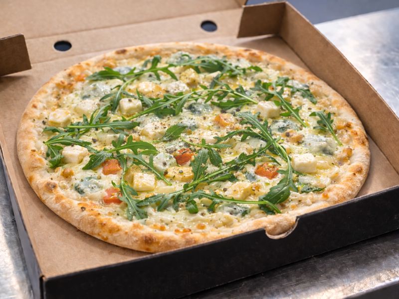 Four x Four four-cheese pizza with mozzarella, gorgonzola, goat's cheese and parmesan from KK Catering.