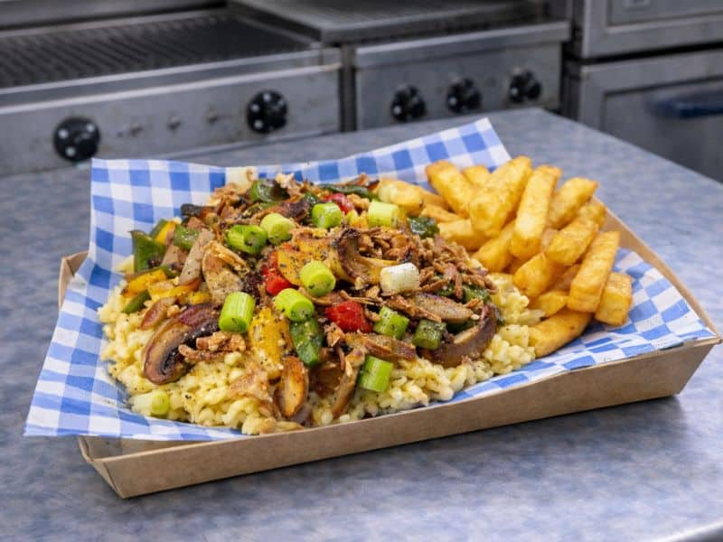 Käsespätzle Bavarian mac and cheese served as a vegetarian option at a KK Catering bratwurst event.