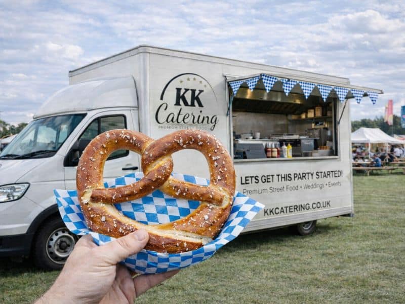 Freshly baked pretzels available as an upgrade at KK Catering bratwurst van events.