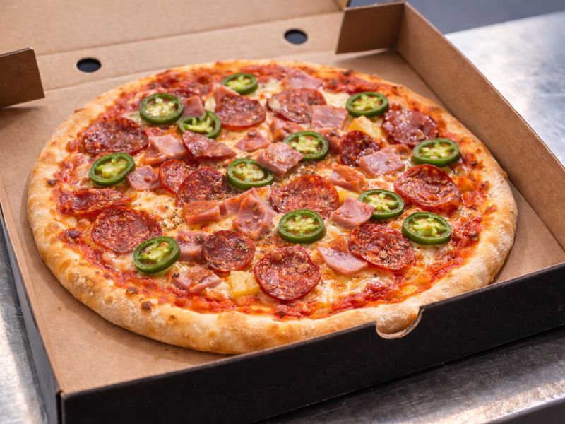 Piggy Pan pizza with pepperoni, chorizo, ham and jalapeños from KK Catering pizza van hire.