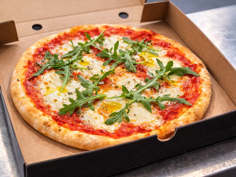Simply Margarita pizza with premium mozzarella, marinara sauce and rocket from KK Catering pizza van hire.